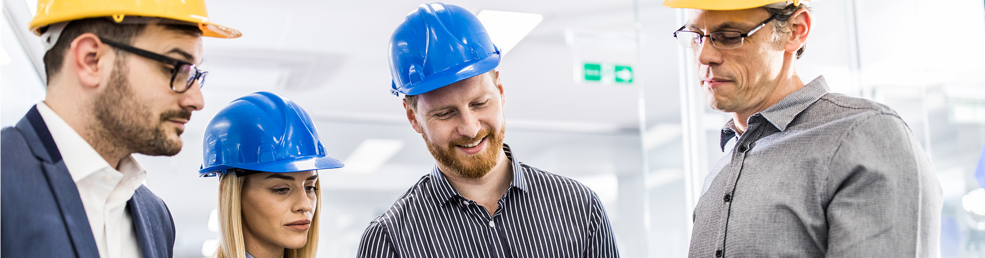 Architects gong through business plans in production hall